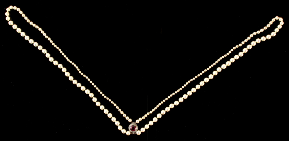 A graduated pearl two row necklace, the largest pearls approx. 5mm dia., the clasp set with a cut