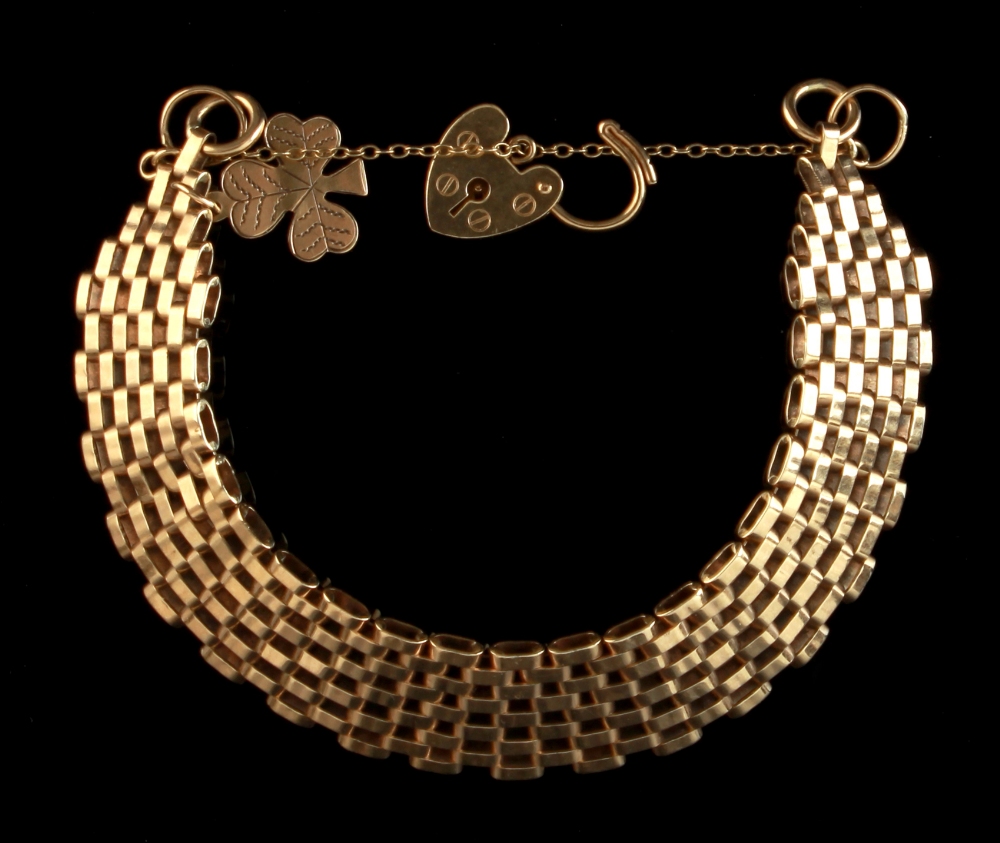 Property of a deceased estate - a 9ct gold bar link bracelet with heart shaped lock & cloverleaf