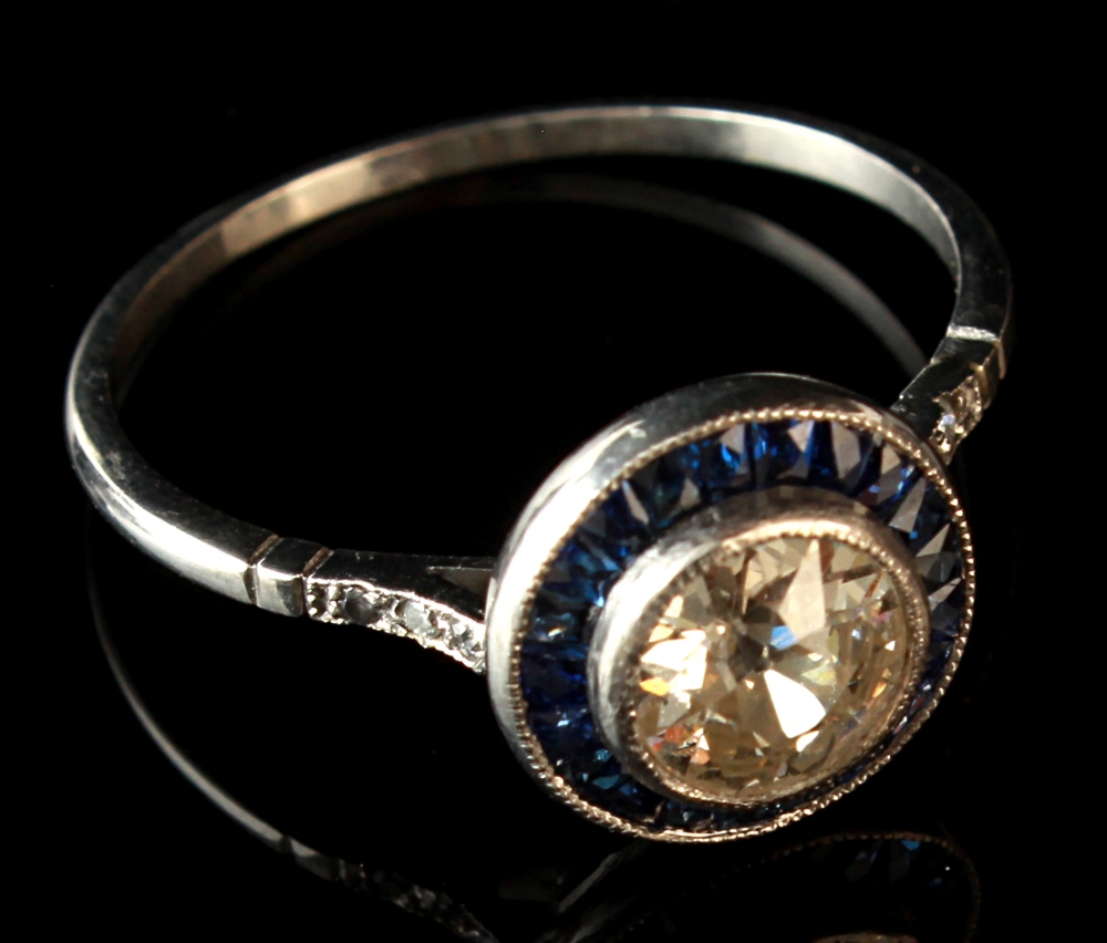 A diamond & sapphire ring, the old European cut diamond weighing approximately 0.65 carat,