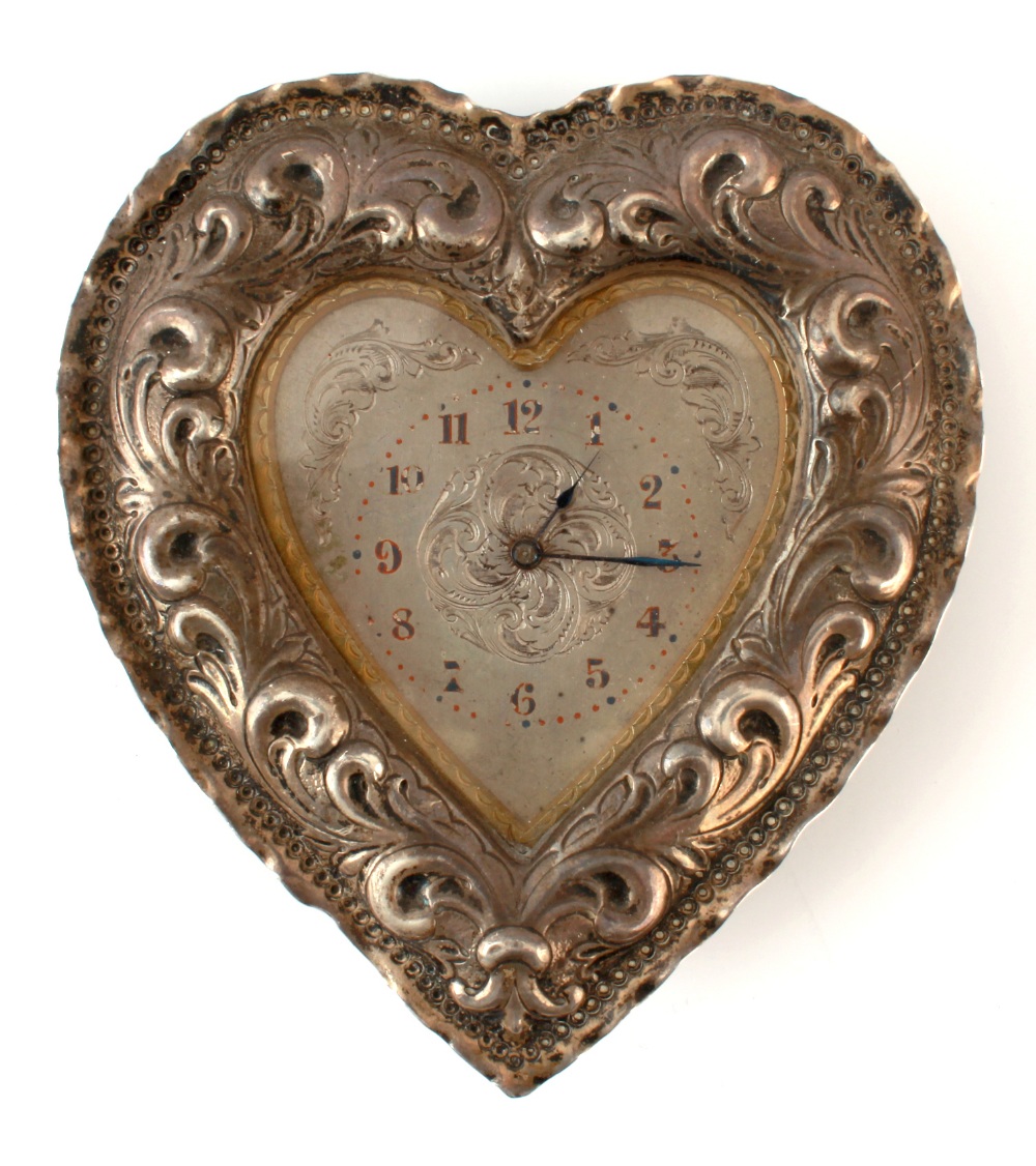 Property of a lady - a Victorian silver heart shaped boudoir clock timepiece, makers Charles
