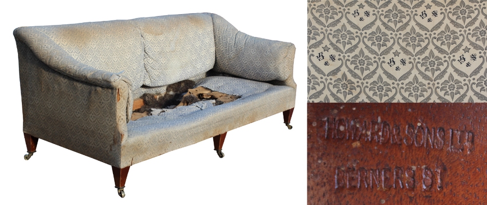 Property of a deceased estate, a lady of title - an early C20th Howard & Sons sofa, with remnants