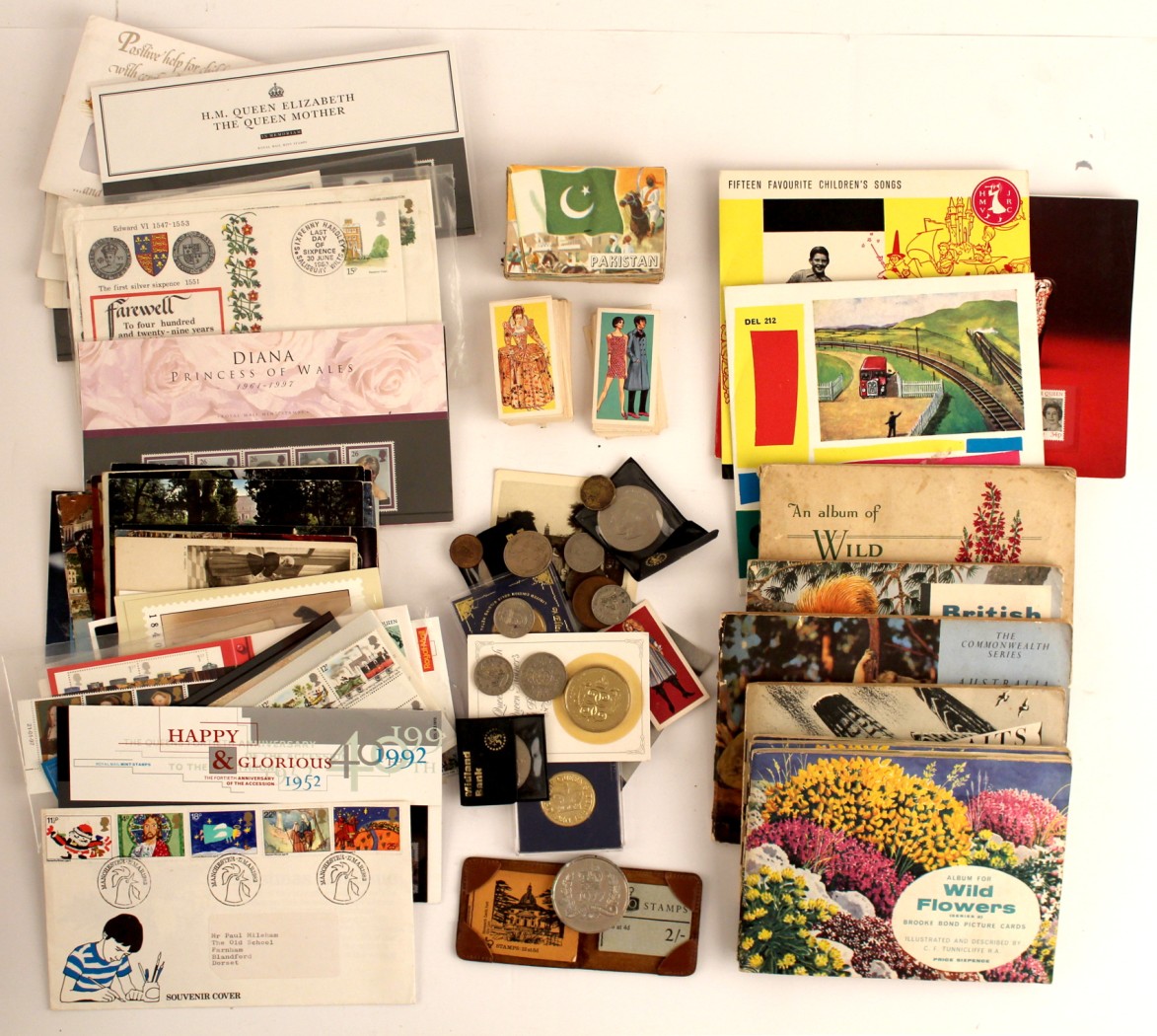 Property of a lady - a box containing assorted items including unused postage stamps.