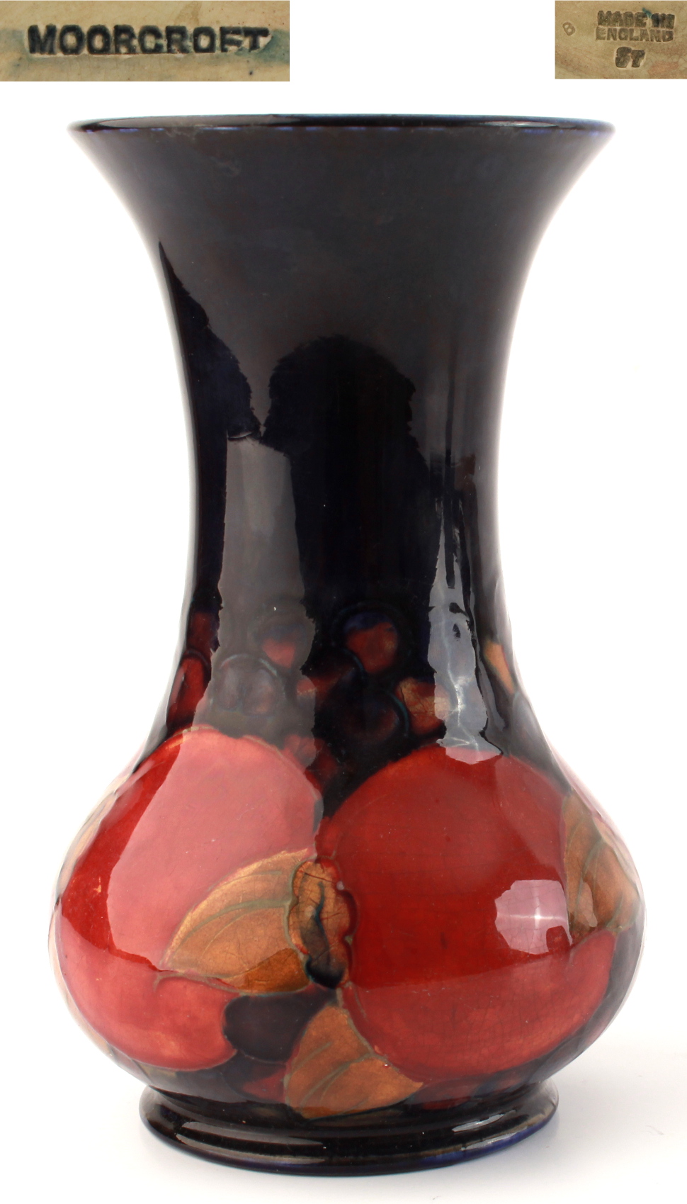 Property of a gentleman - a Moorcroft pomegranate pattern baluster vase, chip to footrim, 7.