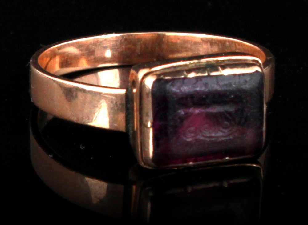 Property of a lady - an unmarked antique probably Georgian gold ring with purple `stone` intaglio