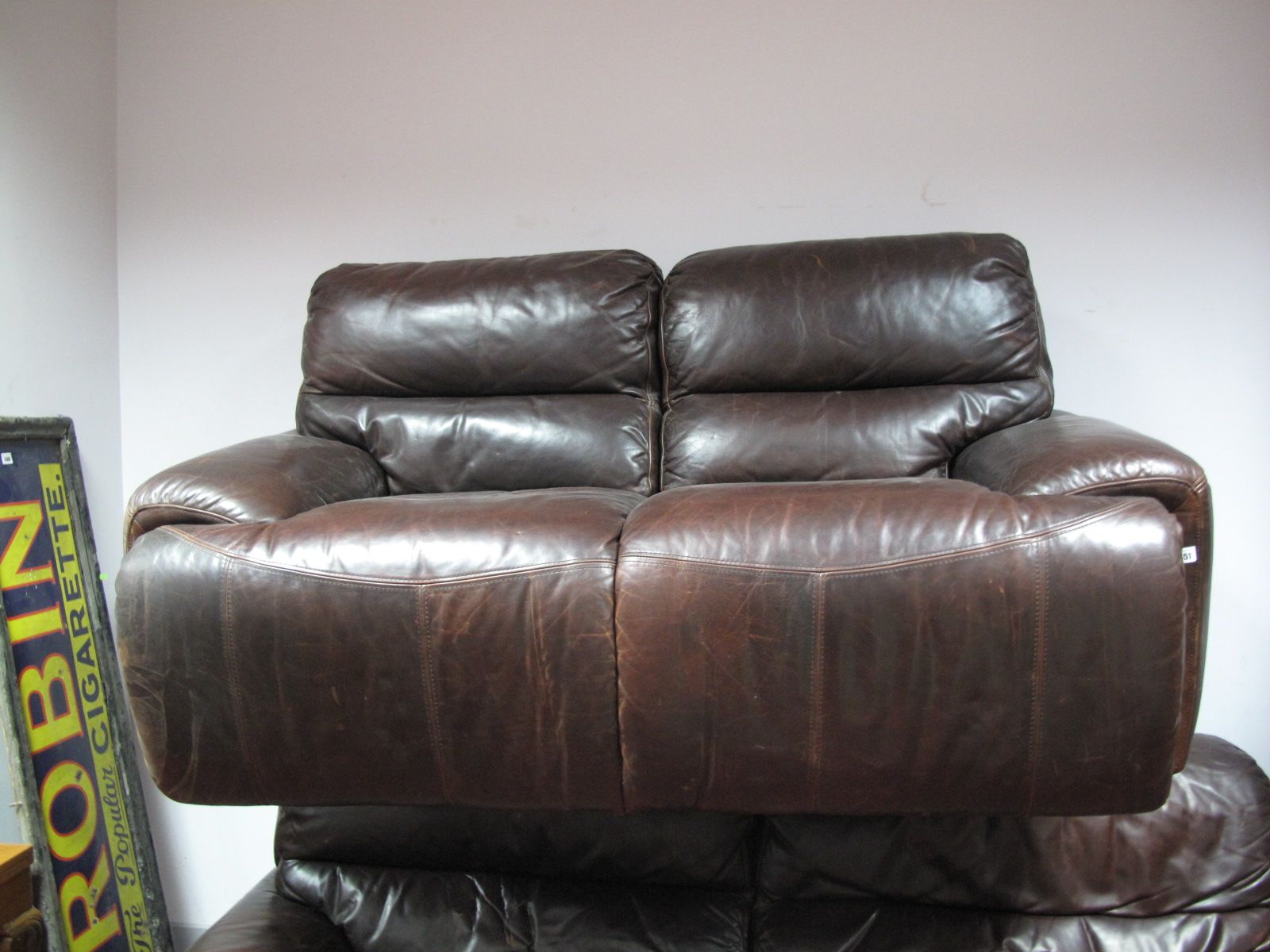 A Two Seater Brown Leather Reclining Settee.