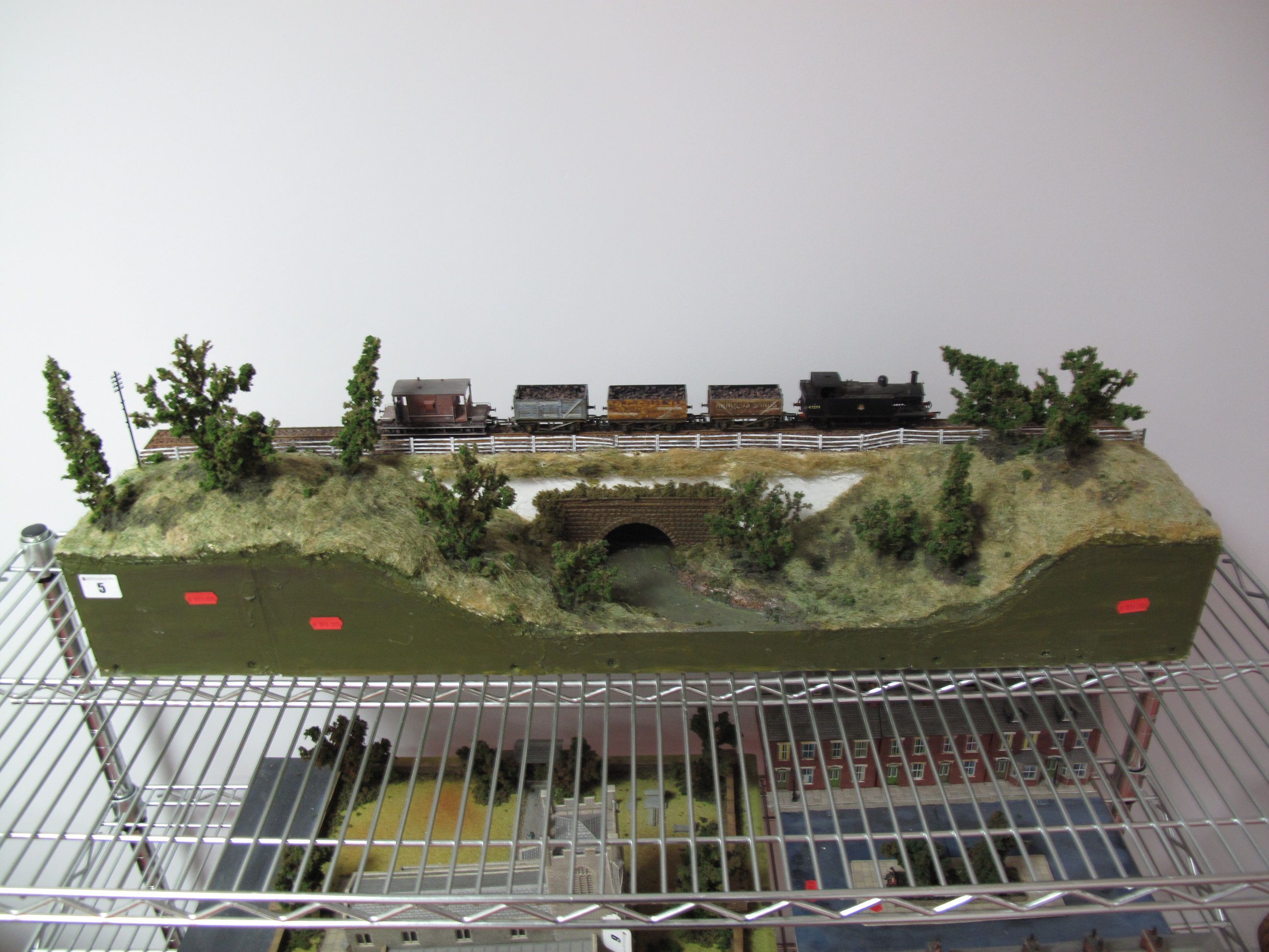 An "OO" Scale Model Railway Diorama of a Country Railway, going over a river, complete with a