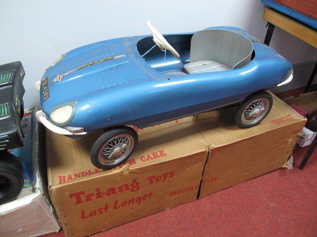 A 1960`s Tri-ang Pedal Car in the Form of an E-Type Jaguar. Pressed steel finish in blue. Appears