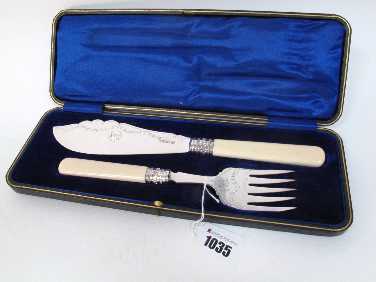 A Pair of Hallmarked Silver Fish Servers, Joseph Elliot & Sons, Sheffield 1909, in fitted case.