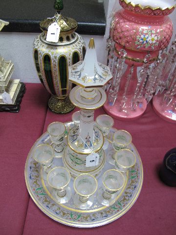 A Late XIX Century Continental Opaque Glass Liqueur Set, enamelled and gilt with arabesques and