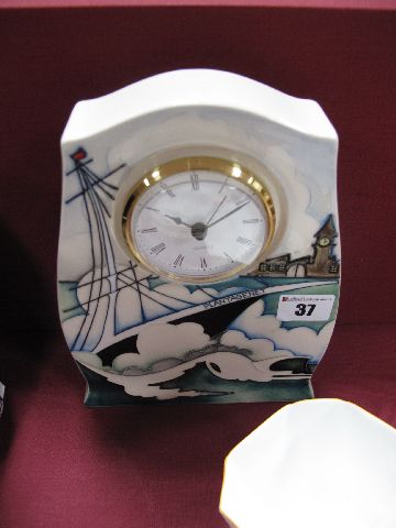 A Moorcroft Pottery Clock in the Plantagenet Design, impressed and painted marks to base, quartz,