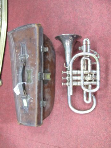 An Early XX Century F Besson ""Prototype"" Silver Plated Cornet, with three spare valves and three