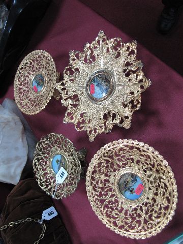 A Graduated Pair of Victorian Gilt Metal Tazzae, each centred by a glazed, painted mother or pearl
