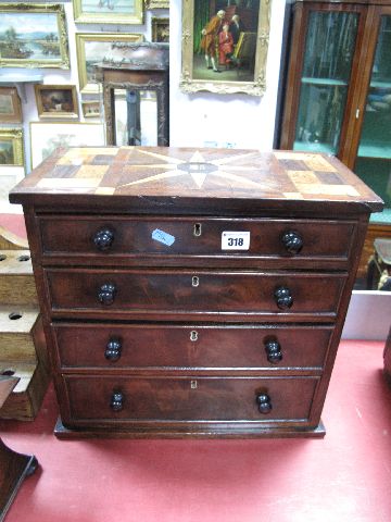 A XIX Century Mahogany Miniature Chest of Drawers, with marquetry top and four small drawers on