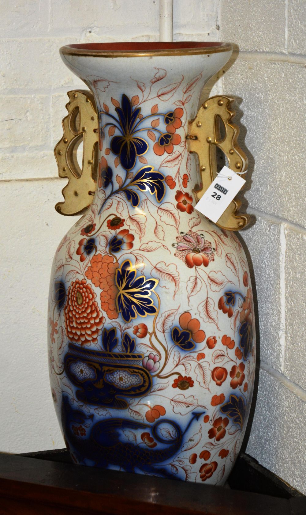 A large Imari style floor vase, decorated with chrysanthemums and dragons, with gilt handles, 66cm