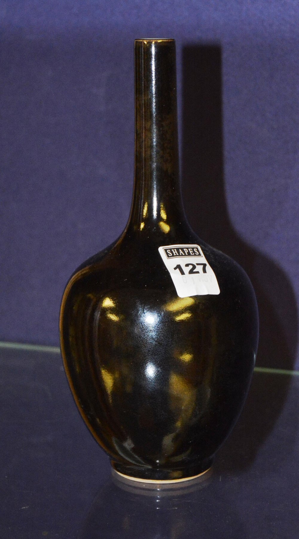 A Chinese black glazed onion shaped vase, 21cm high