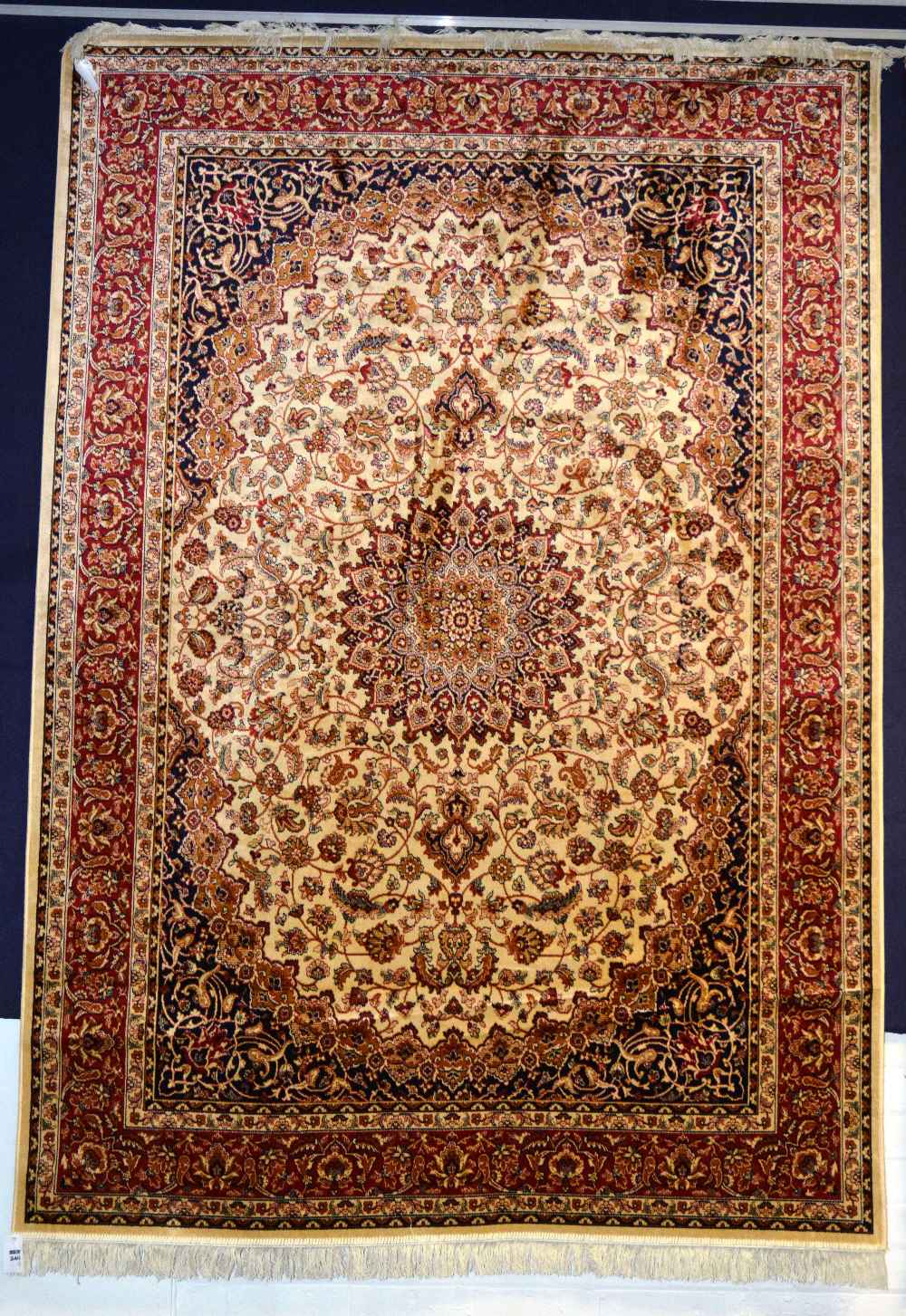 A Kashan motif carpet/wall hanging, the central medallion with allover floral design on cream ground