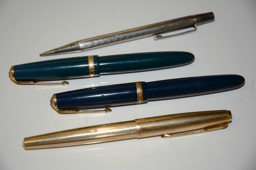 Three Parker fountain pens, including a ball point (4)
