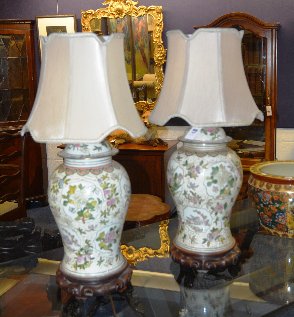 A pair of large famille rose vases and covers, converted to lamps, 40cm high (2)