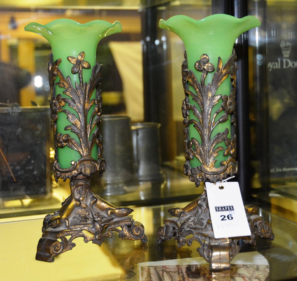 A pair of green glass vases, each with flared scalloped rim, on gilt metal stands and lizard mounted