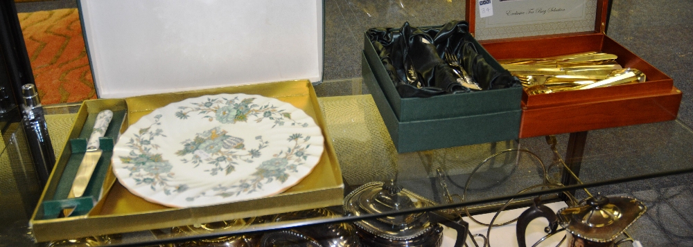 Two boxed sets of Epns and brass cutlery, together with a Crown Staffordshire boxed cake plate and