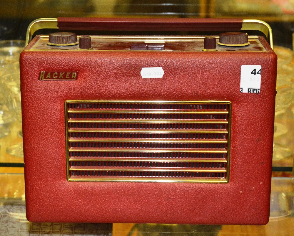 A vintage red Hacker portable radio, RP35, circa 1960's