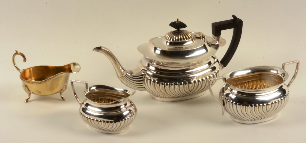 A 20th Century EPNS tea set comprising of tea pot, coffee pot, milk jug, sugar bowl and sauce