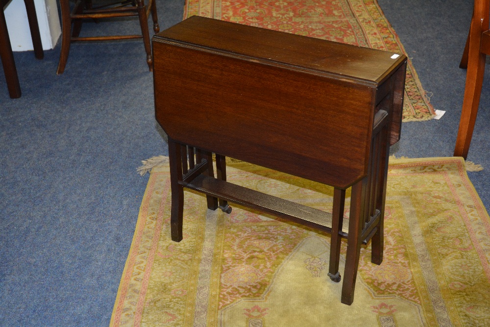 A mahogany Sutherland table - the rectangular top with canted corners, raised on square legs with