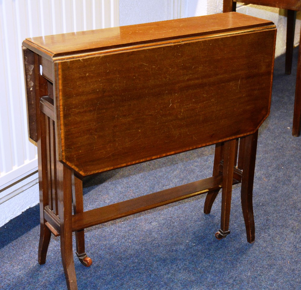 An Edwardian mahogany Sutherland table, the brass bonded moulded top on square legs united by