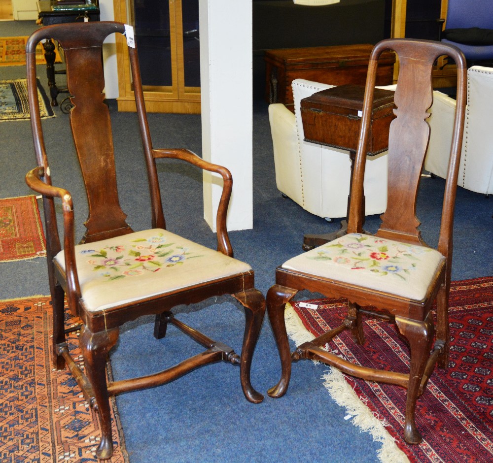 A set of eight Queen Anne style mahogany dining chairs,each with sloped splats and drop in needle