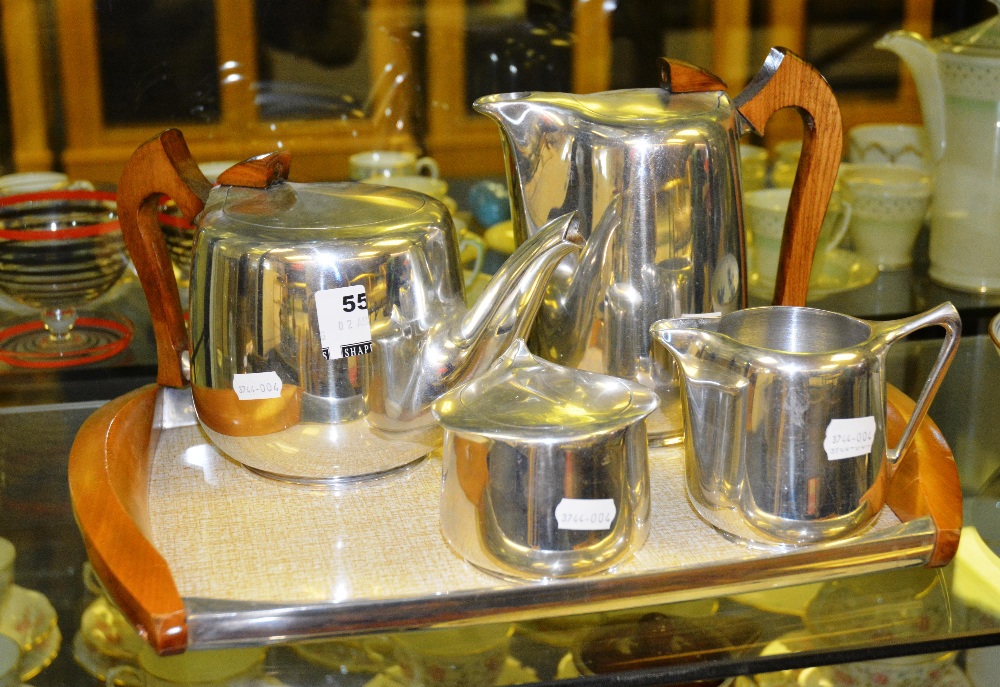 A collection of picquot ware consisting of a coffee pot, teapot, milk and sugar, and tray (5)