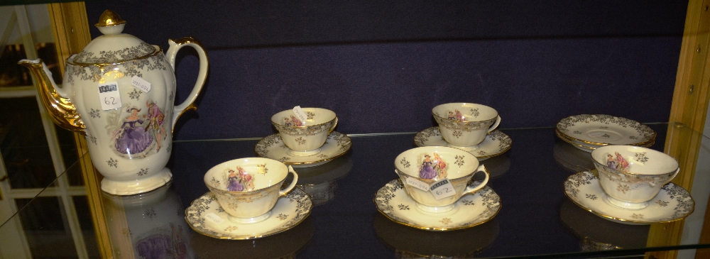 A Limoges part tea set consisting of five cups and saucers, one coffee pot and two saucers,