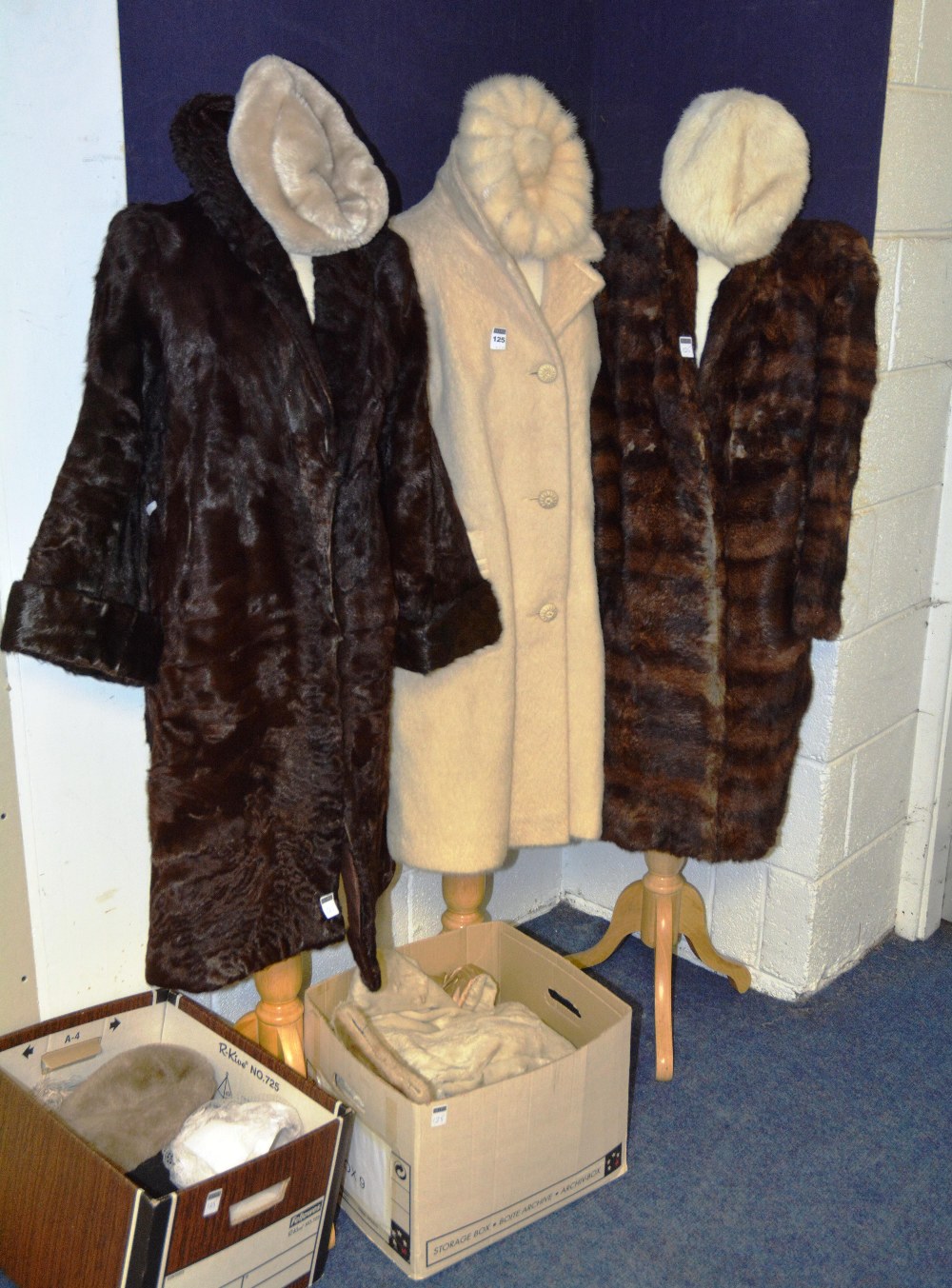 A selection of ladies vintage coats and hats, including two brown fur coats, fur hats, gloves and