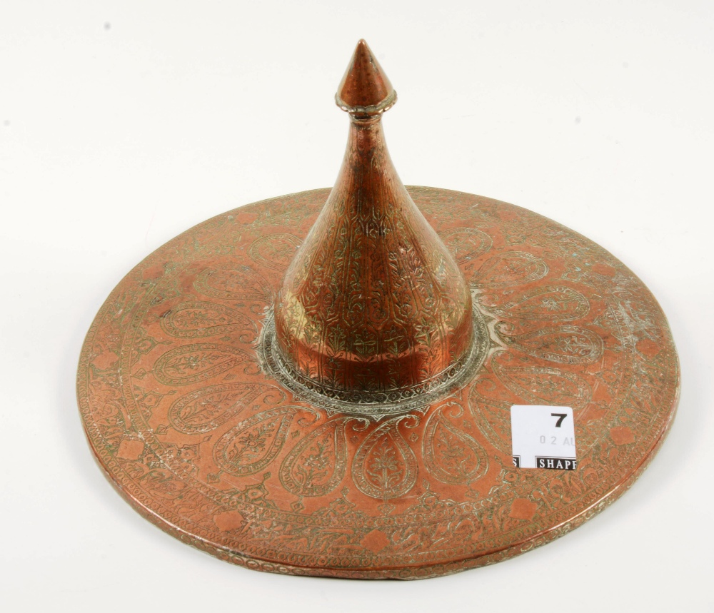 A copper Islamic hood with engraved detail, circa 1900