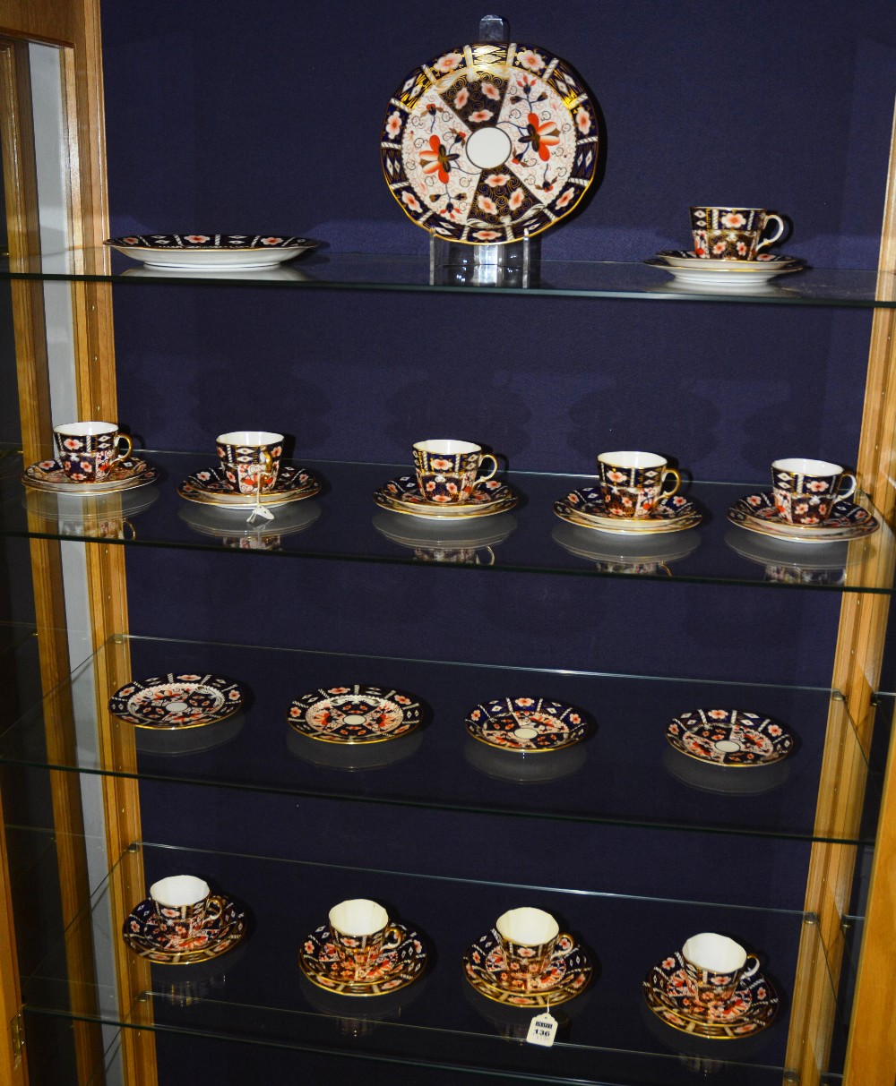 A Royal Crown Derby part teaset in Imari pattern, comprising 10 cups, 12 saucers, 12 side plates and