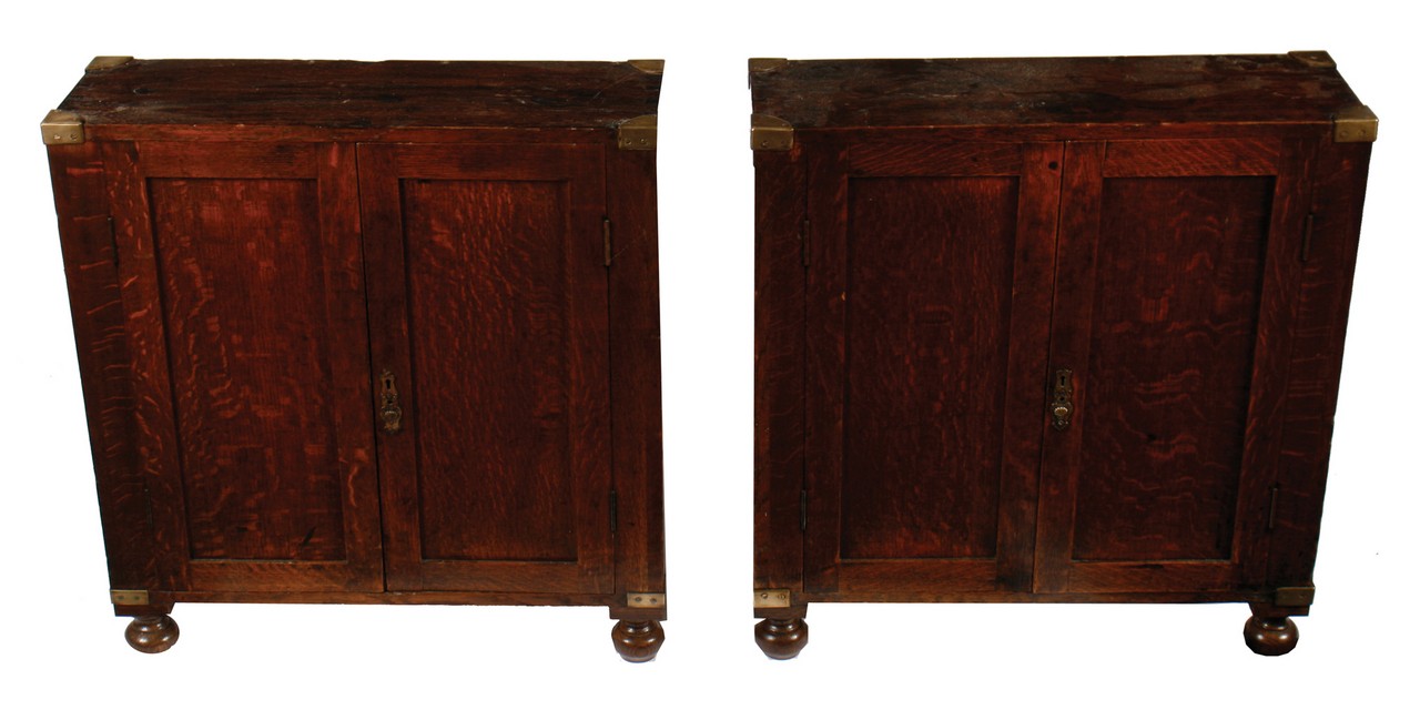 Pair of nineteenth-century brass bound campaign bedside cabinets  Each 65 cm. wide