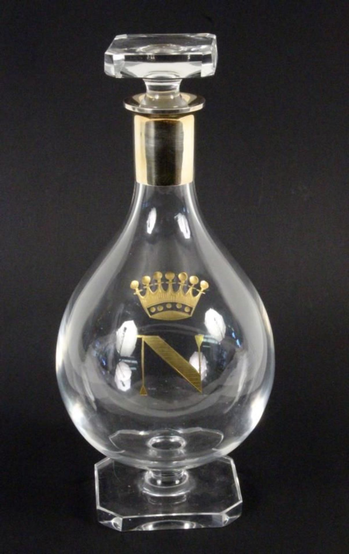 A ''NAPOLEON'' COGNAC DECANTER WITH STOPPER Colourless glass with cut and crowned by a gilded ''N'';