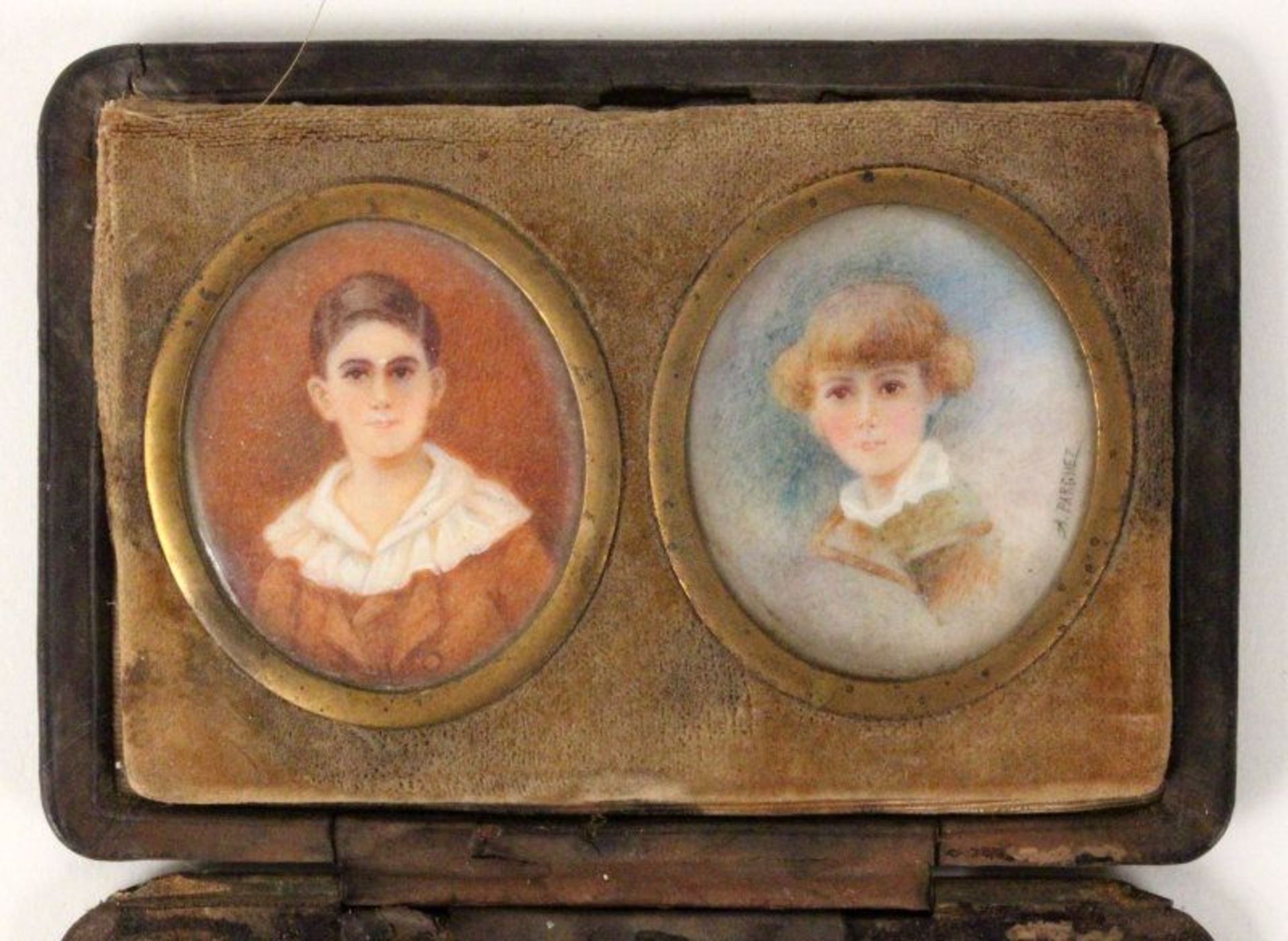 A PAIR OF MINIATURES 1900 Two portraits of children in case. painted on ivory. Signed: A. Parguez.