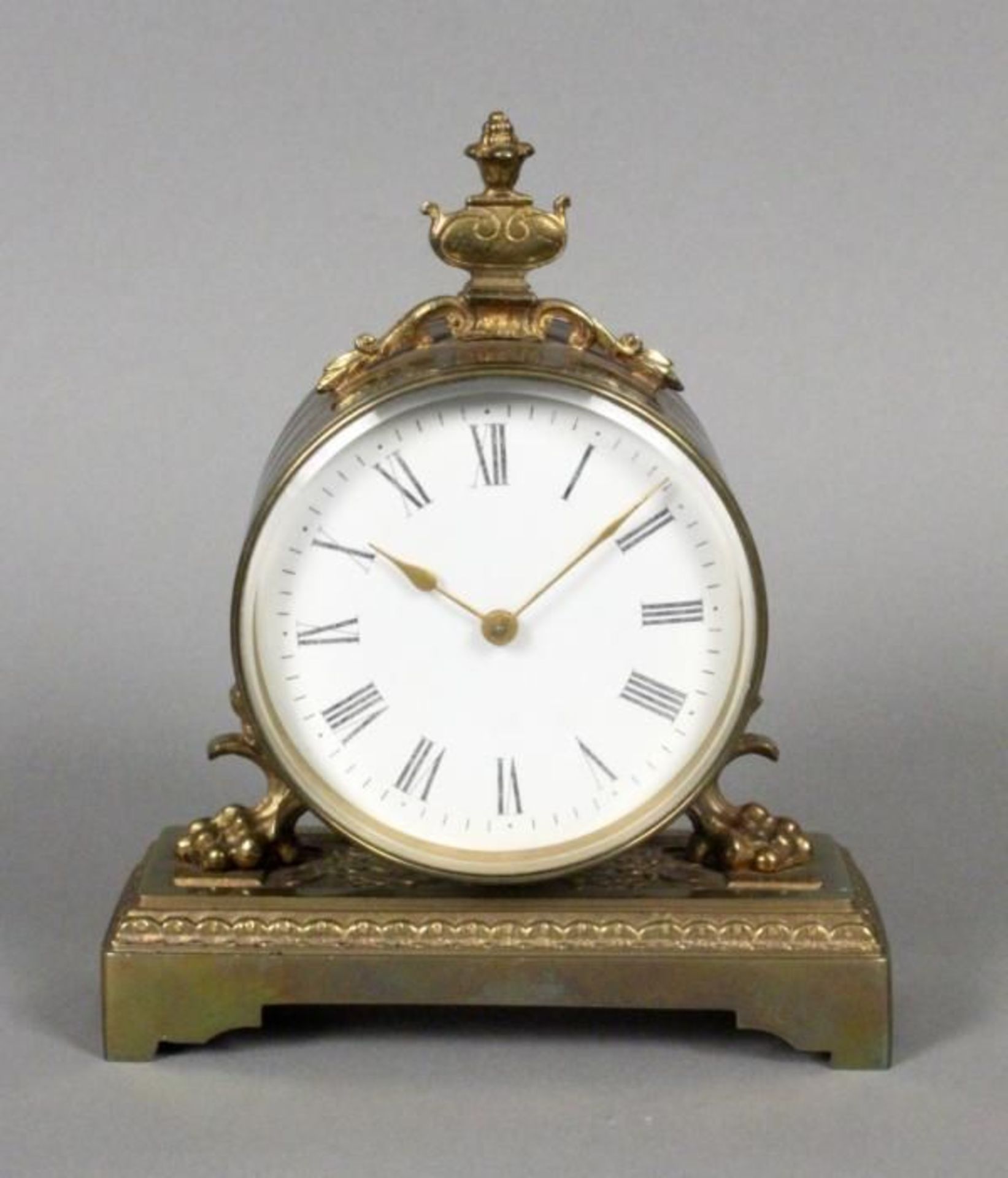 A DESK CLOCK ca. 1900 Brass case, enamel dial with Roman numerals, mechanical with key wind