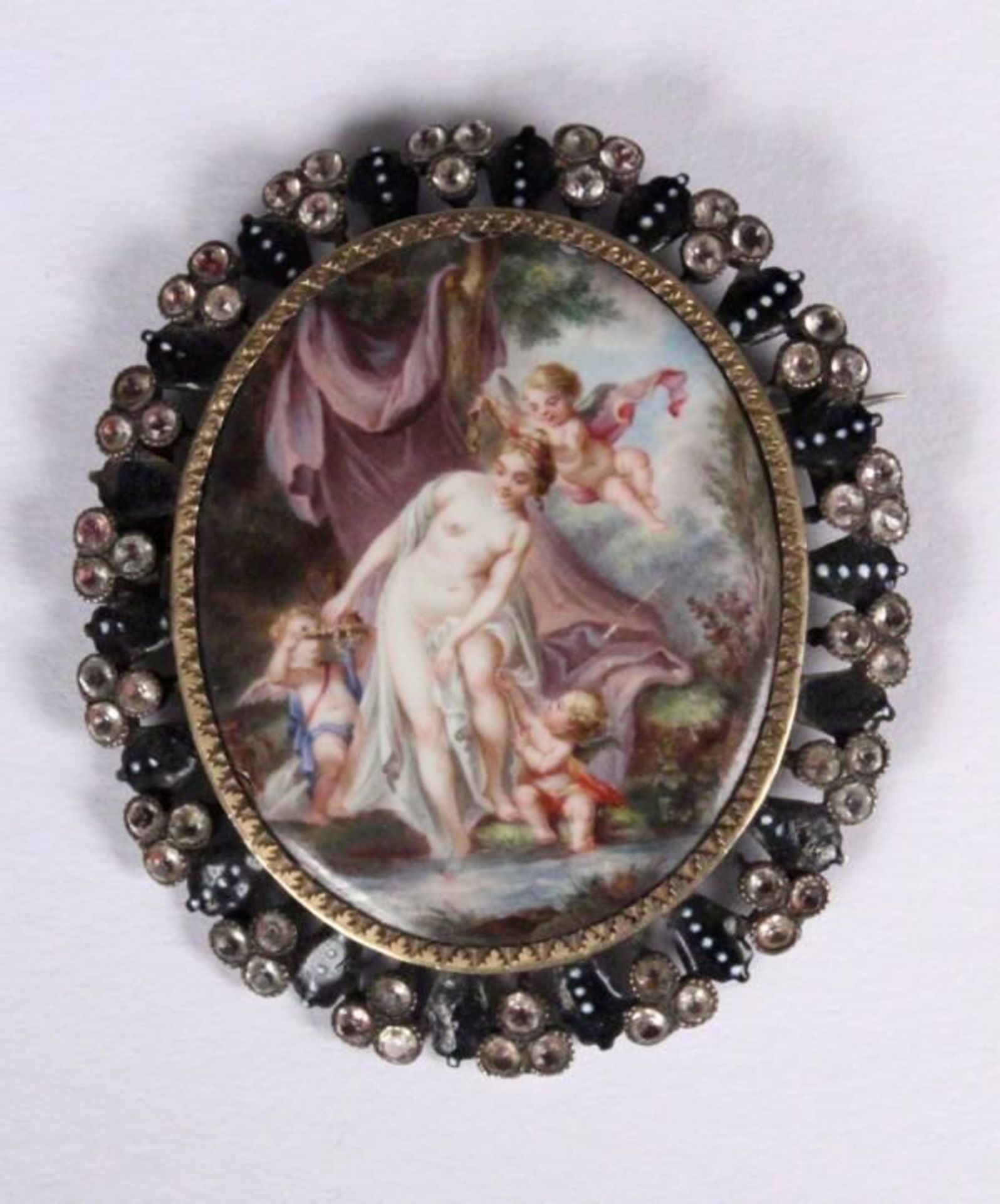 A MINIATURE BROOCH 19th century A colourful painted scene with cherubs and nymphs, enamel, in silver