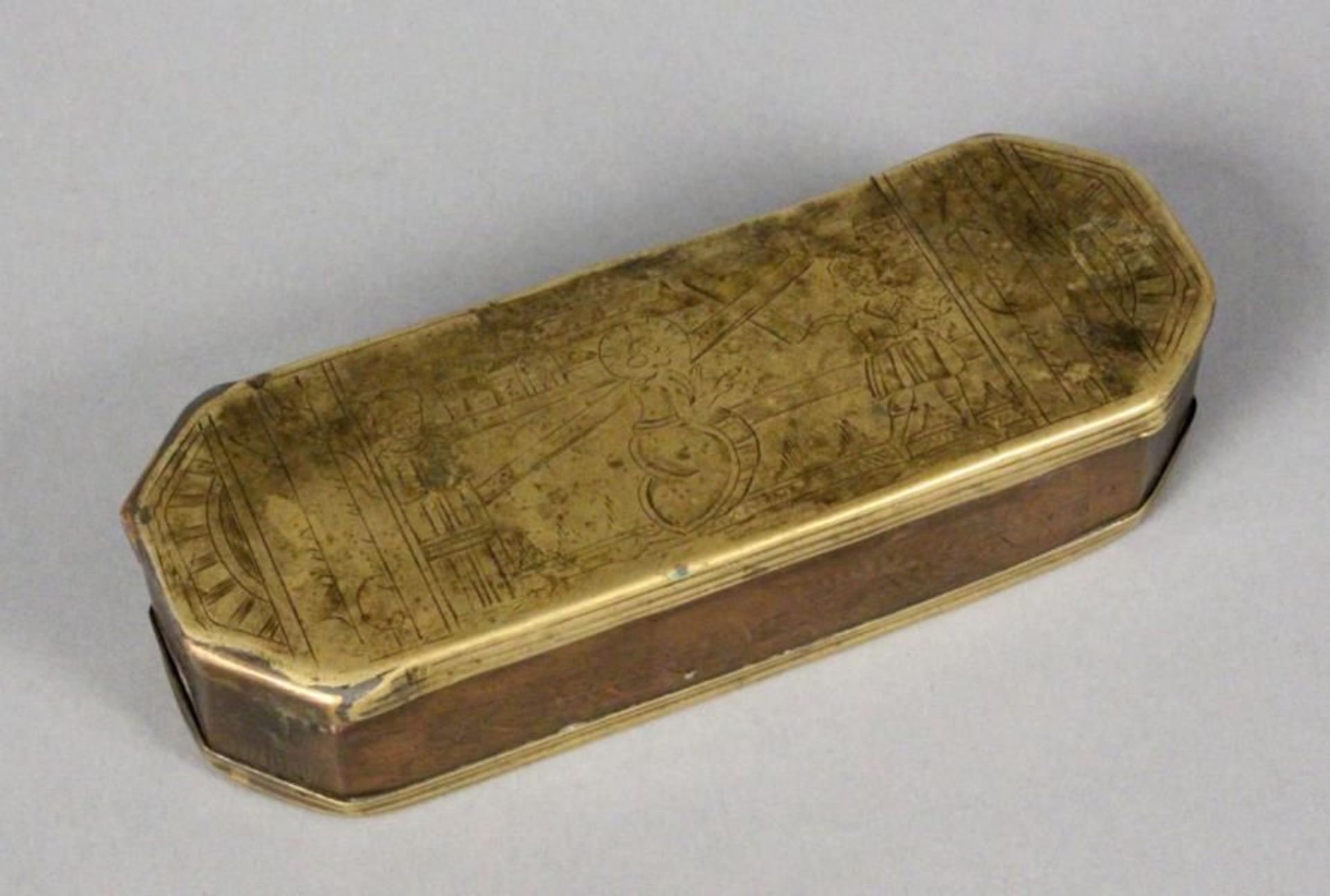 A TOBACCO BOX probably Iserlohn, 18th century Brass and copper, with engraved decor, length 15.2cm.