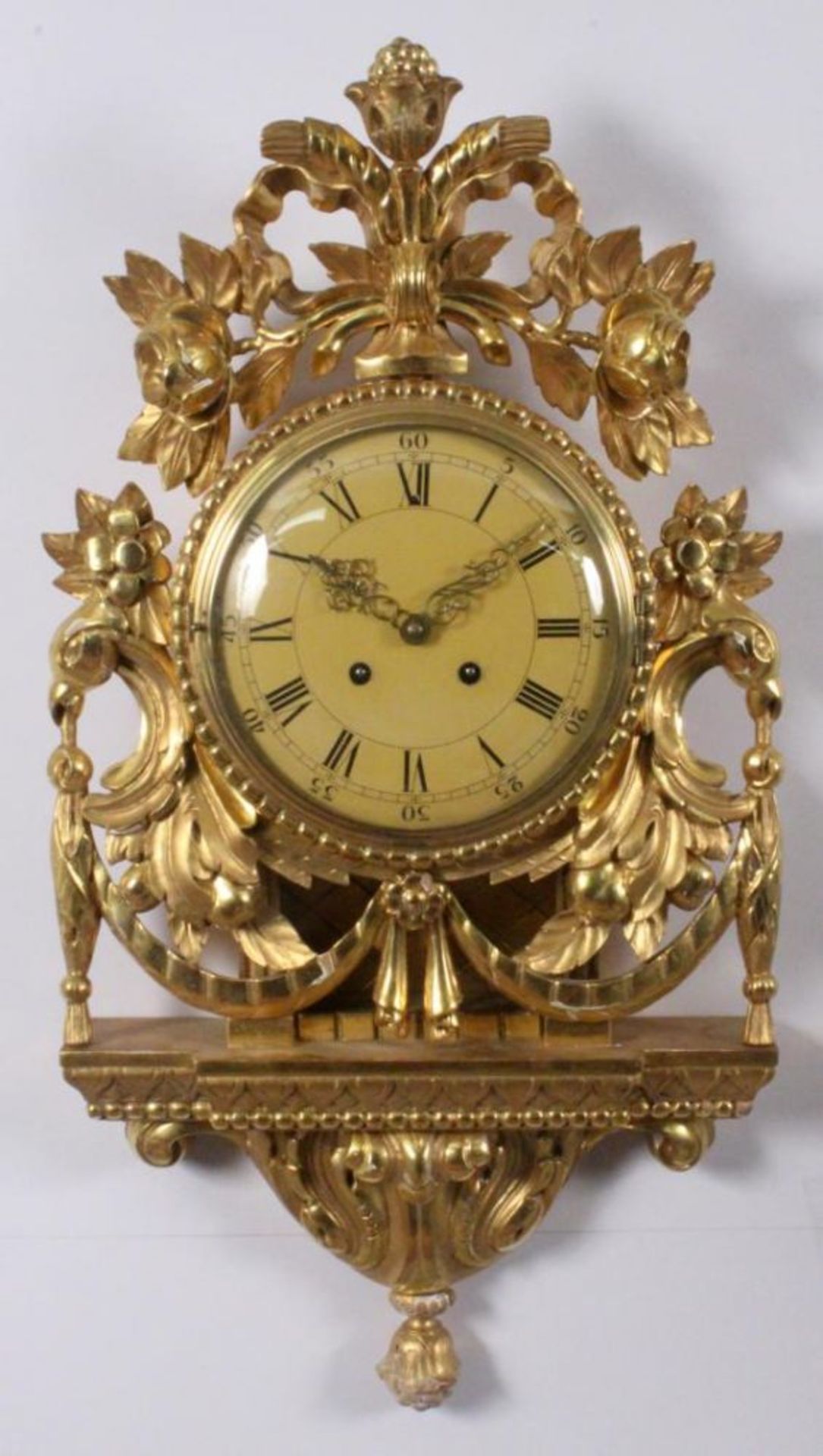 A CARTEL CLOCK Sweden Gilded case of baroque style, pendulum with striking the hours on a bell,