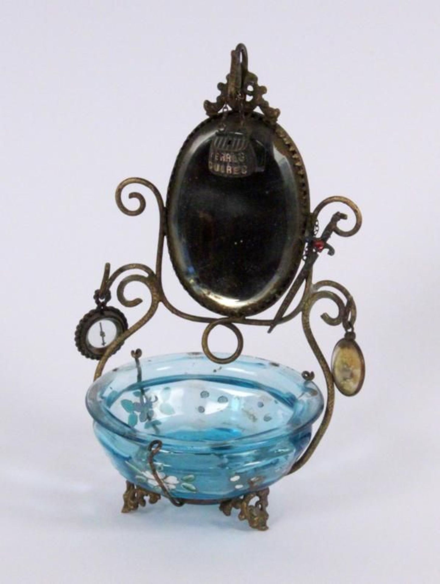 A POCKET WATCH STAND ca. 1900 Brass with blue glass bowl and hangers, height 17cm.    Starting
