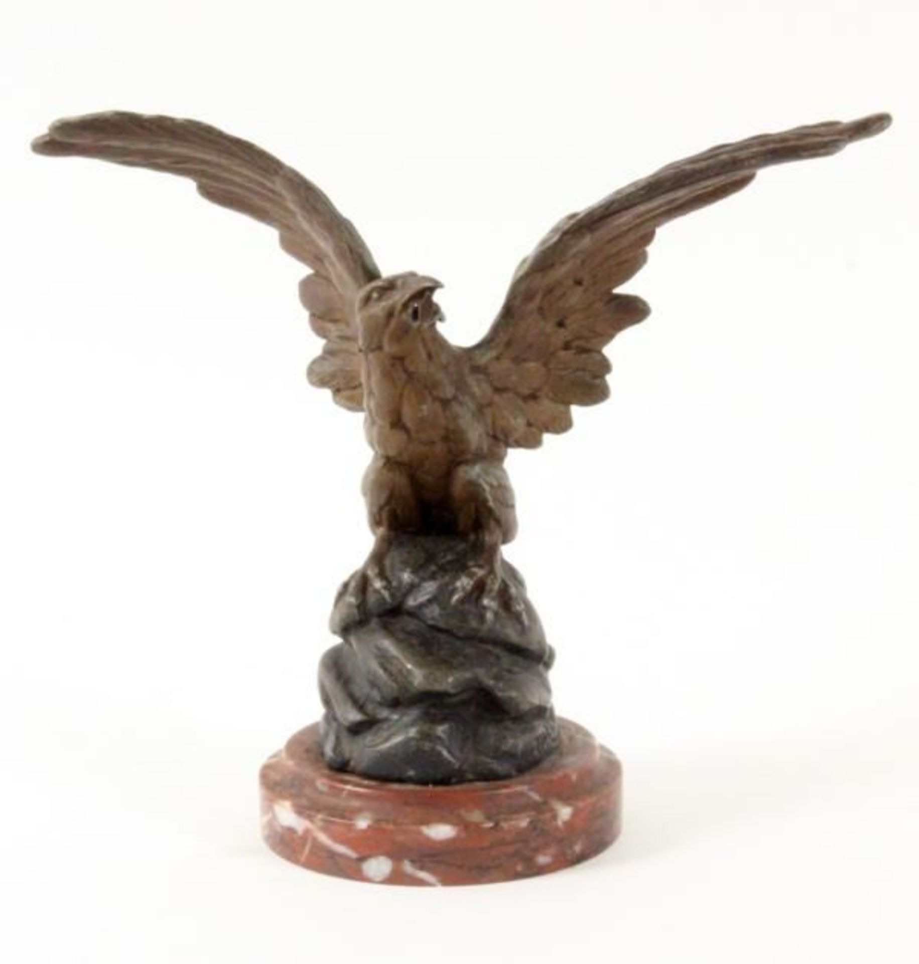 A POCKET WATCH STAND formed as an eagle c.1900 Patinated cast metal on marble base. Height 17,5cm