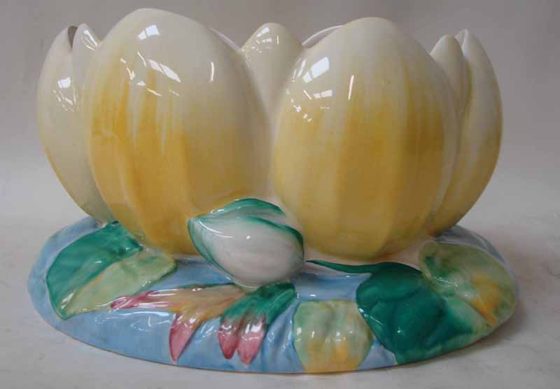 A Clarice Cliff Newport Pottery Fruit Bowl in the form of a water lily, yellow leaves on oval leaf