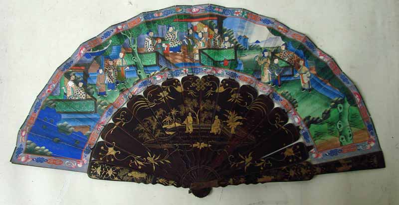 A 19th century thousand faces fan, the guards and sticks lacquered and gilt decorated with figures