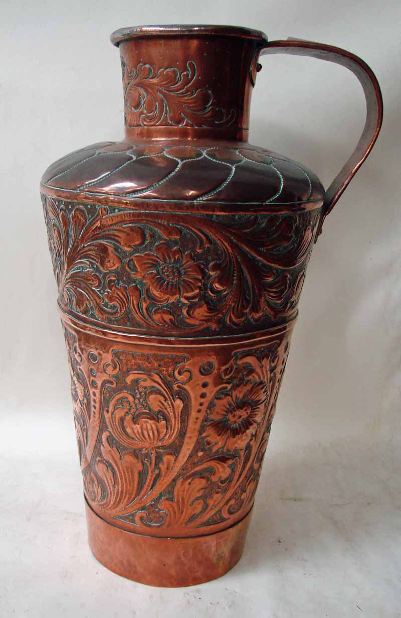 An Arts and Crafts single handle copper amphora style vase, of tapering form with rounded shoulder