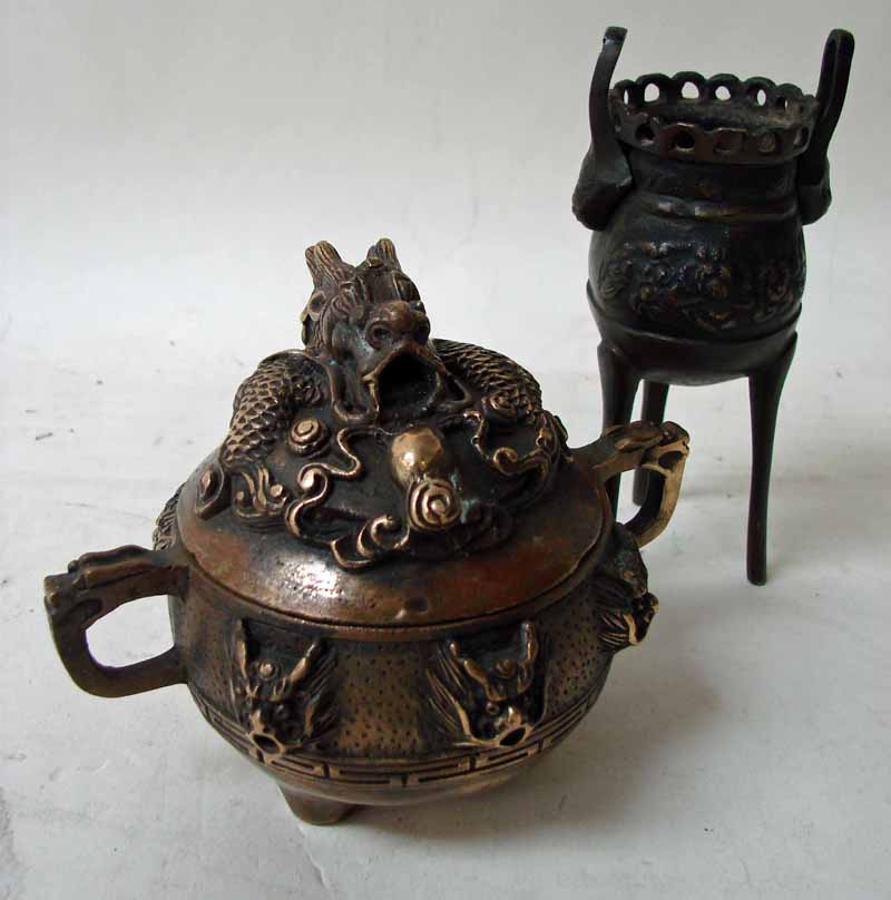 A 19th century oriental bronze Koro, the removable cover cast with dragon and pearl knop, two