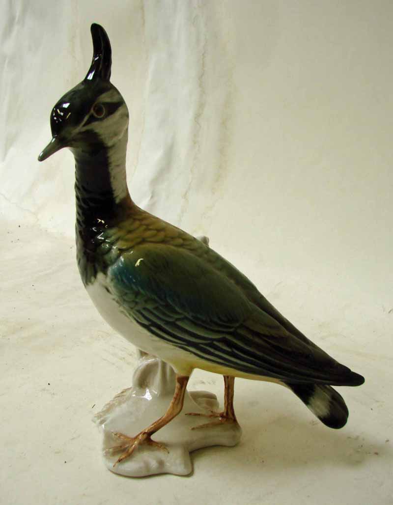A Karl Ens porcelain model of a Lapwing, printed windmill mark to underside, 20cm high