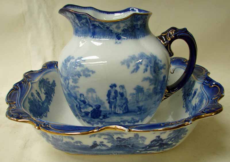 A Doulton Burslem dressing table jug and bowl of shaped rectangular form, blue and white decorated