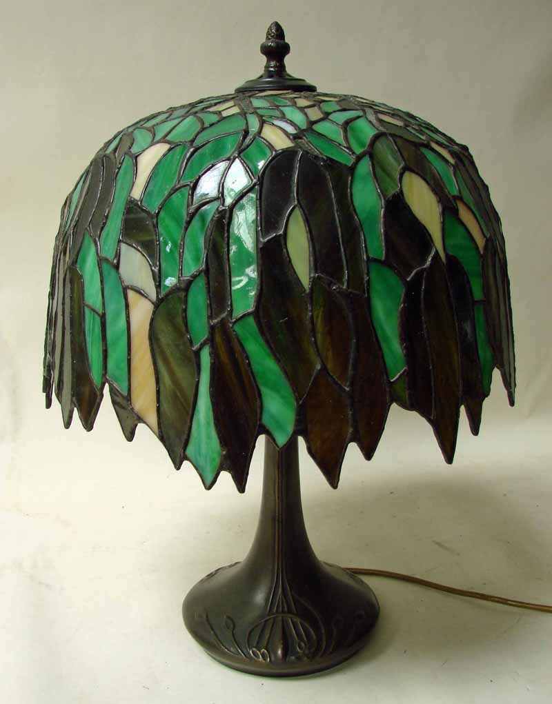 A good quality Tiffany style table lamp, Weeping Willow design on a bronze patinated flared